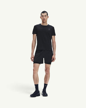 Amateur men's black performance running t-shirt with fast-drying technical fabric worn by a male model.