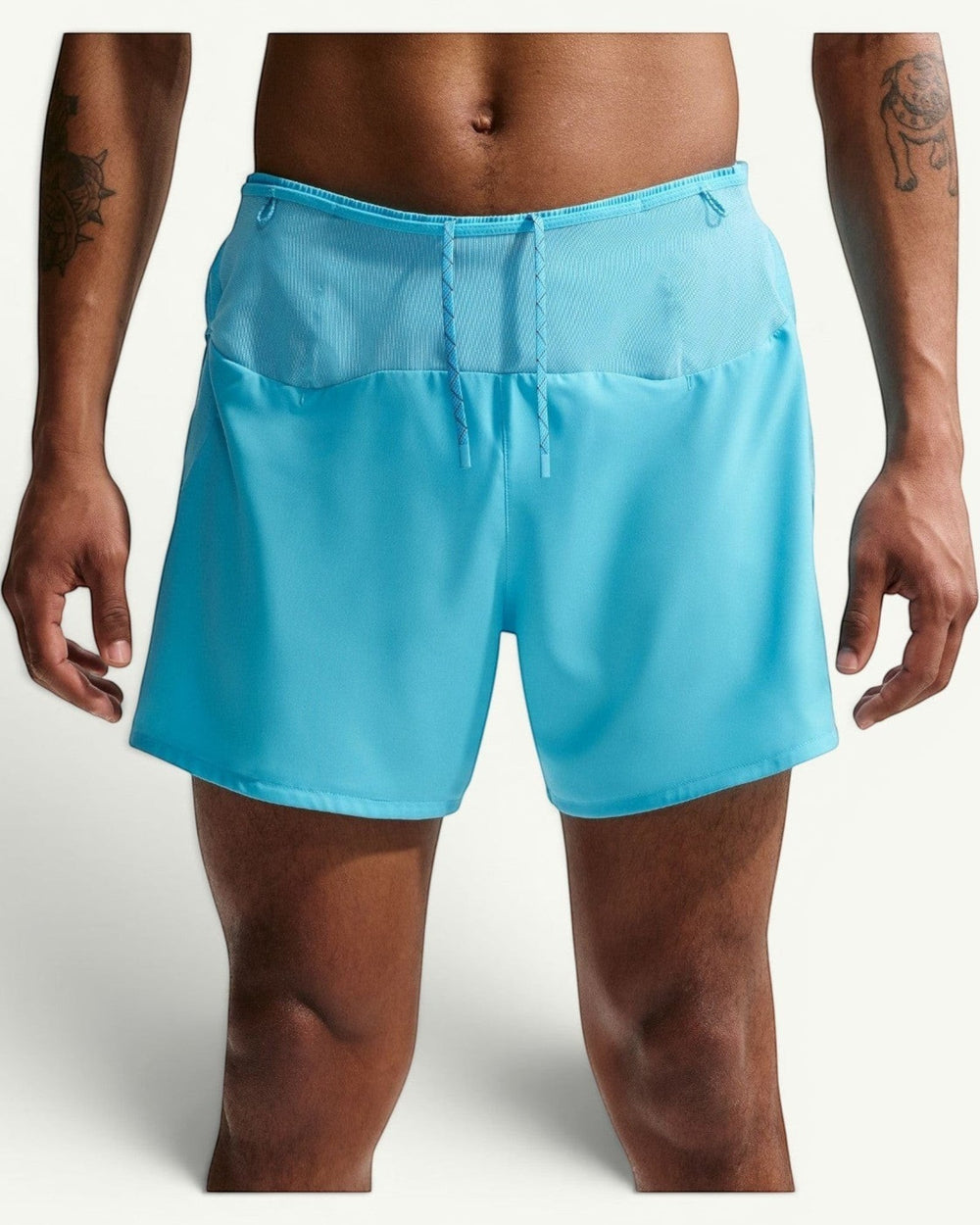 Amateur men's light blue 5-inch trail running shorts with mesh panels, drawstring waist, and multiple storage pockets.