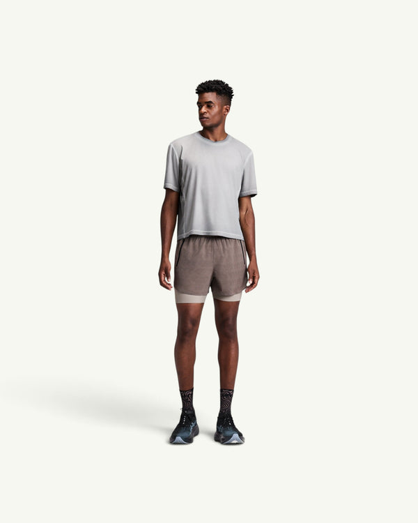 Amateur men's CoolGrid 2-in-1 running shorts in taupe with integrated compression liner and multiple storage pockets
