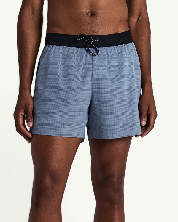 Amateur MEN'S COOLGRID 5 inch run shorts in light blue with a black elastic waistband and drawstring