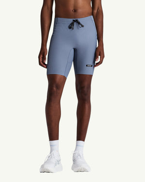 Amateur men's blue Gridlock quarter tights with compressive waffle-knit fabric, internal liner, and storage pockets.