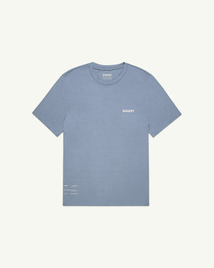 Amateur Men's Micromesh run tee in dusty blue with a crew neckline, breathable fabric, and reflective logo detailing.