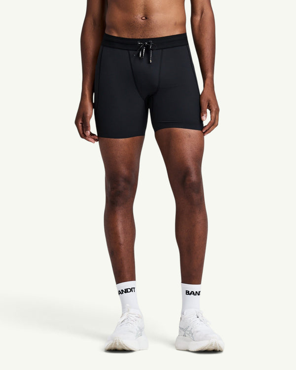 Amateur men's black SoLite quarter tights featuring featherweight compression fabric and a secure waistband.