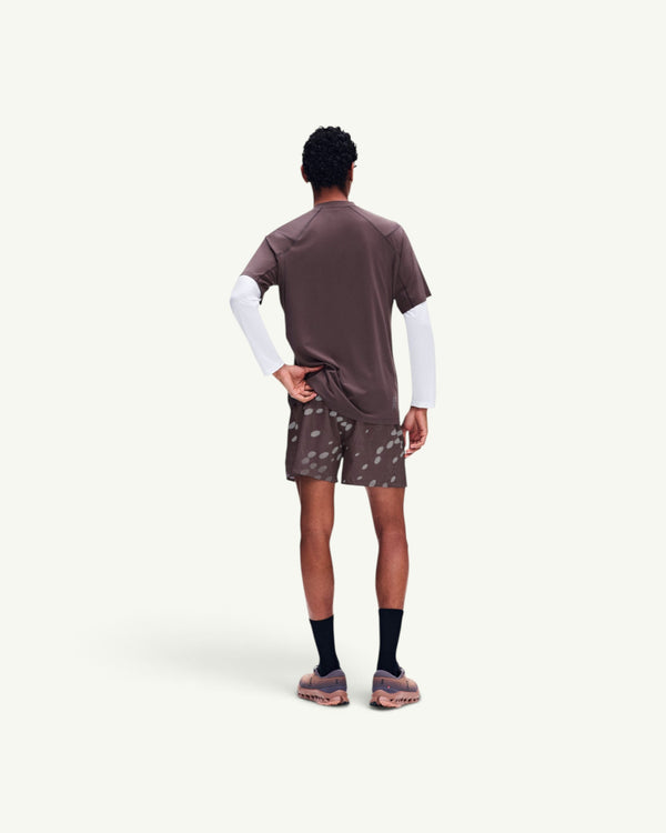 Amateur Men's Trail-T Solar brown short-sleeve shirt with white base layer, worn by a model from the back view.
