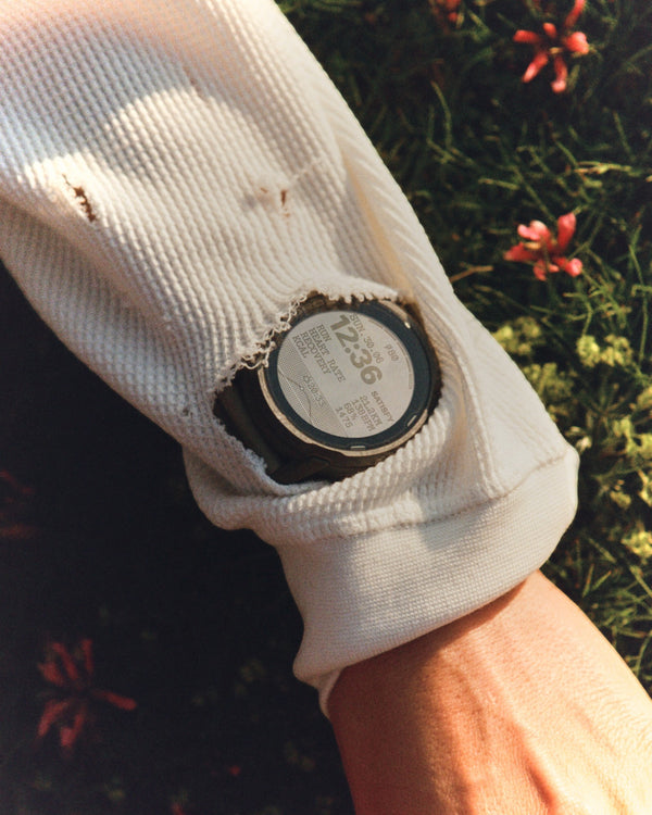 Amateur SATISFY COROS APEX 4 multisport watch in Burnt Olive with a unique crystallized titanium bezel on a wrist.
