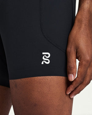 Amateur men's black SoLite quarter tights featuring featherweight compression fabric and a white logo detail.