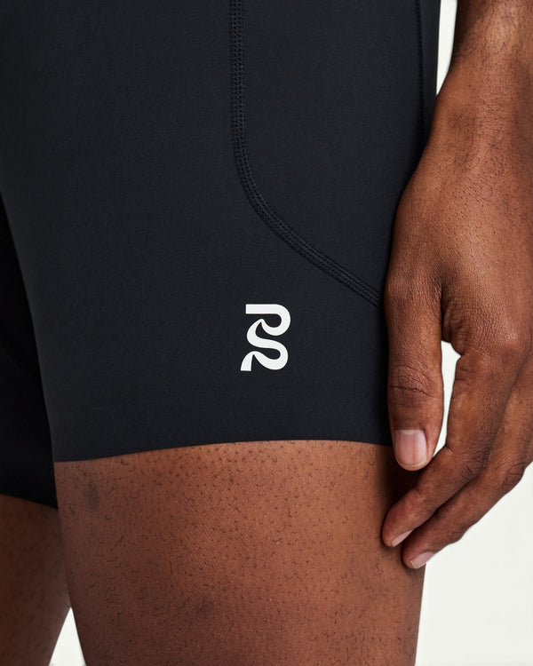 Amateur men's black SoLite quarter tights featuring featherweight compression fabric and a white logo detail.