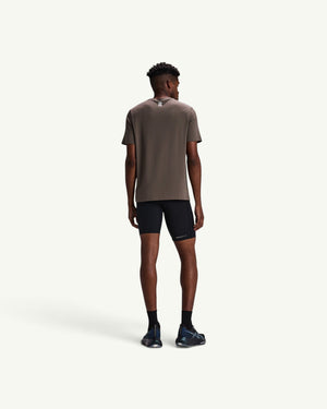 Amateur men's black SoLite half tights featuring compression fit, waterproof pockets, and sleek featherweight fabric.
