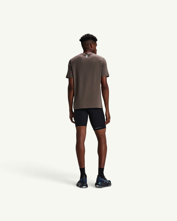 Amateur men's black SoLite half tights featuring compression fit, waterproof pockets, and sleek featherweight fabric.