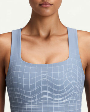 Amateur women's light blue square neck race crop top with a subtle white grid pattern and buttery smooth fabric.