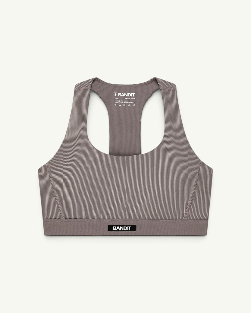 Amateur women's taupe ribbed scoop neck T-back sports bra with compression fit and Bandit branding