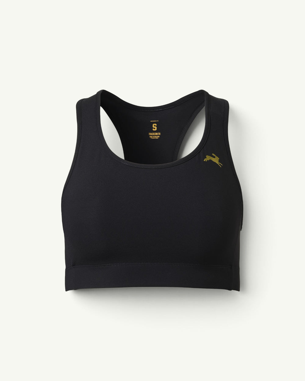 Amateur Tracksmith Allston sports bra in black with a gold hare logo, featuring a supportive racerback design.