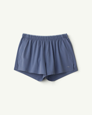 Amateur women's Twilight woven running shorts in slate blue with an elastic waistband and small logo detail.