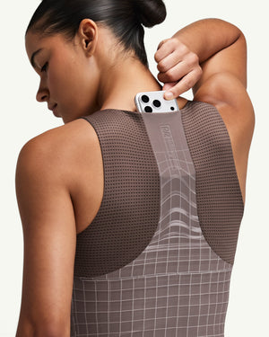 Amateur women's brown Vanisher race crop with GeoMesh back panel and integrated phone pocket for running storage