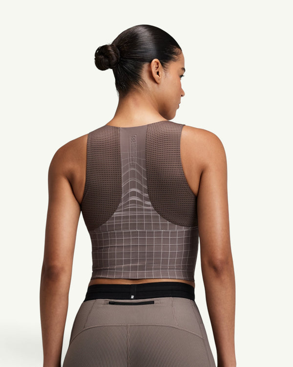 Amateur women's brown square neck race crop top with GeoMesh back panel and storage pockets, back view