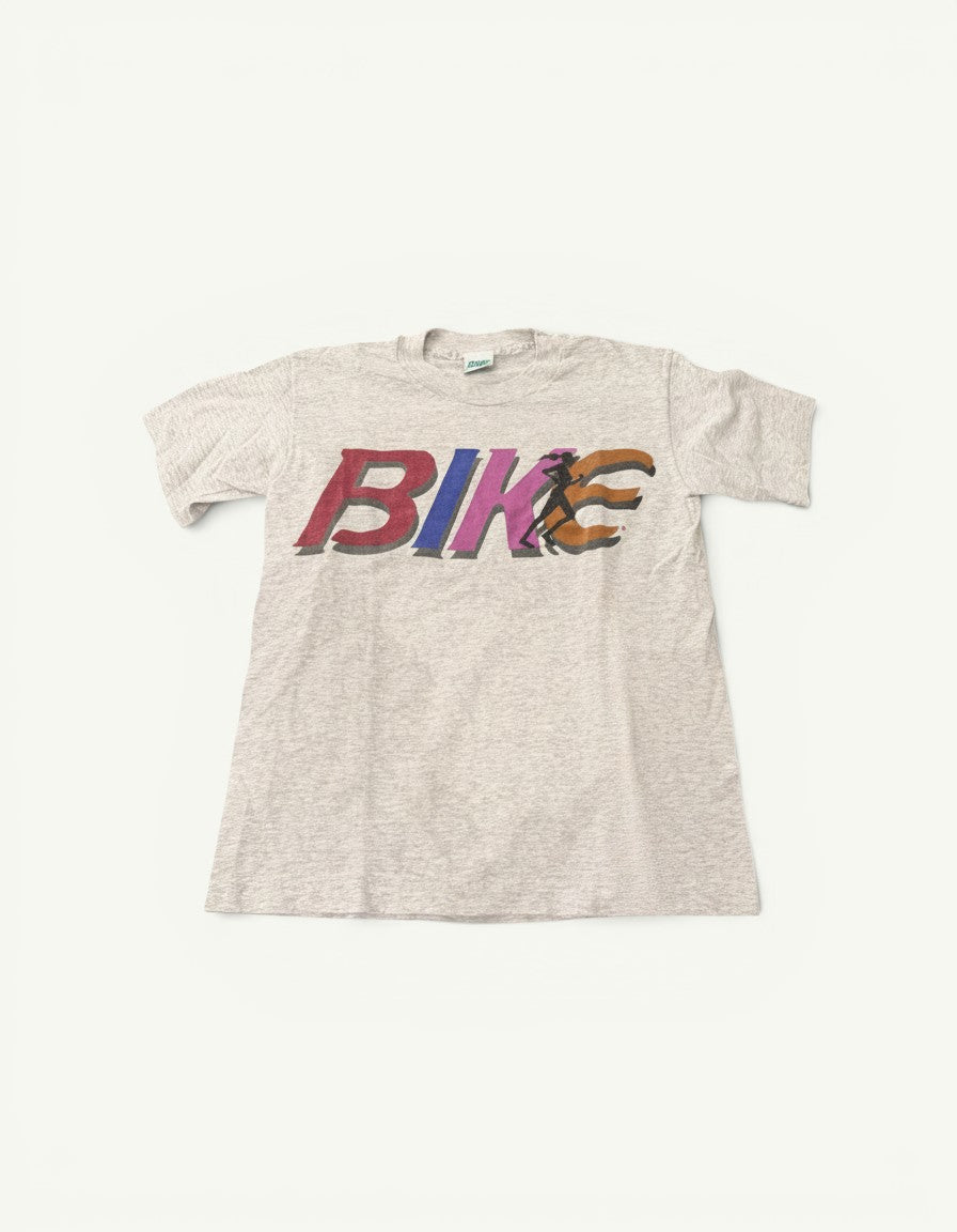 Amateur pre-loved vintage white cotton t-shirt with a colourful retro Bike graphic print on the chest