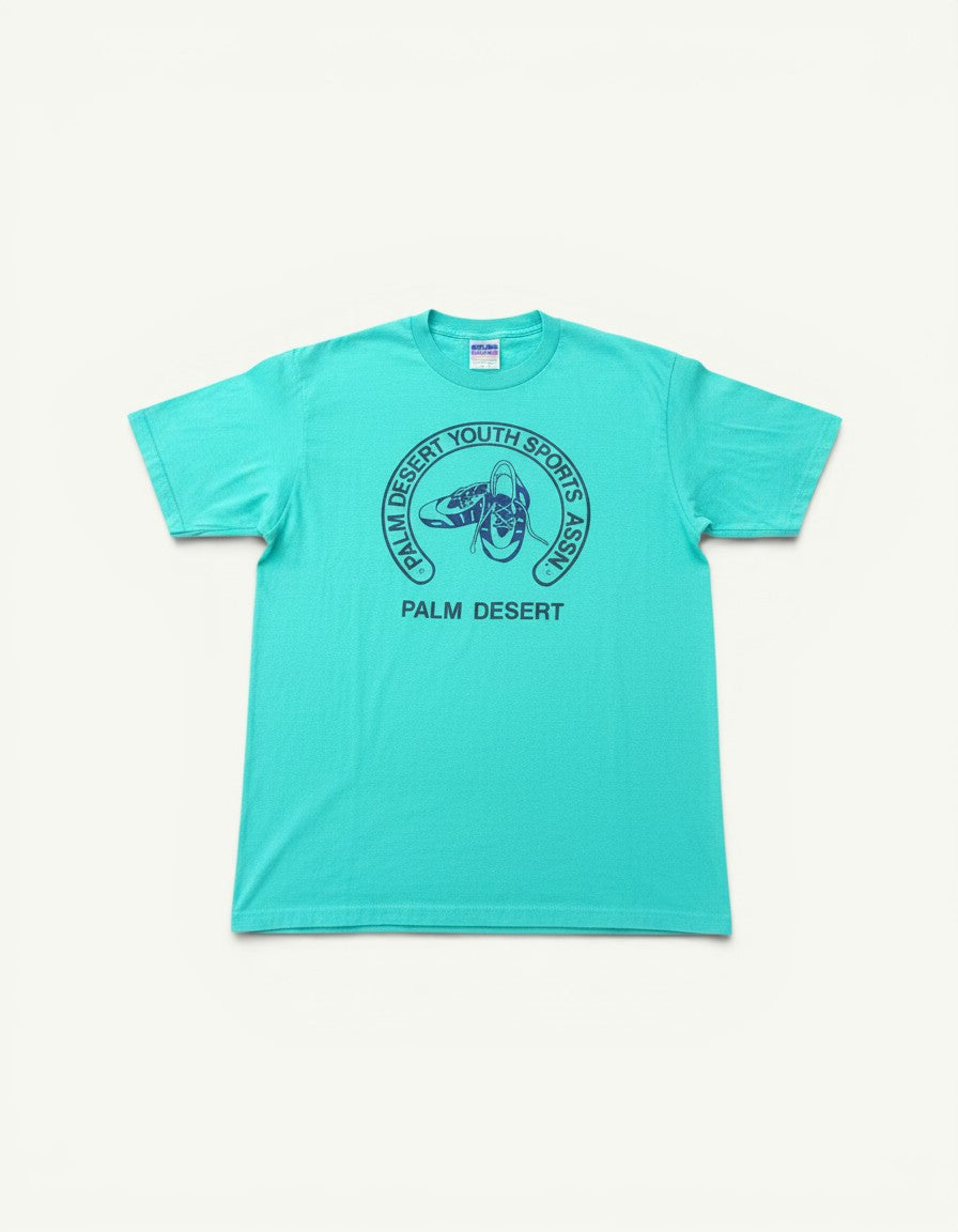Amateur vintage Hanes t-shirt in bright teal with a dark blue Palm Desert Youth Sports graphic print.