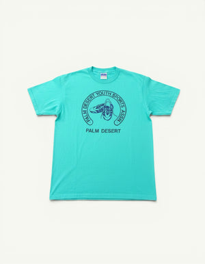 Amateur vintage Hanes t-shirt in bright teal with a dark blue Palm Desert Youth Sports graphic print.