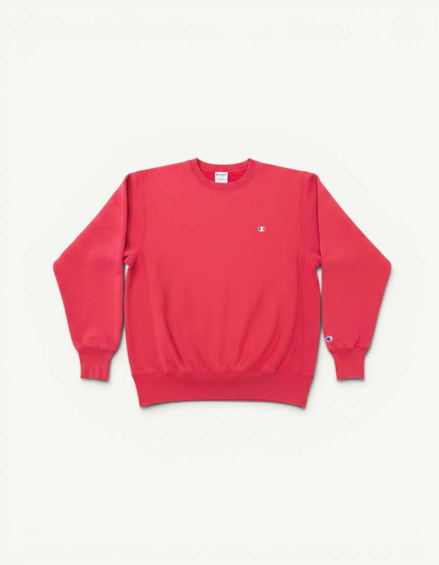 Amateur vintage washed pink Champion crewneck sweatshirt with small embroidered logo on chest and sleeve