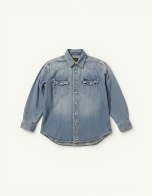 Amateur vintage-wash light blue denim shirt with snap buttons and two chest pockets.