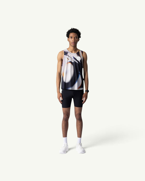 Amateur White Glass singlet featuring a blurred abstract print on lightweight stretch fabric worn by a male runner.