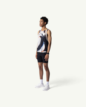 Amateur White Glass singlet featuring a blurred glass print on lightweight performance fabric worn by a male runner