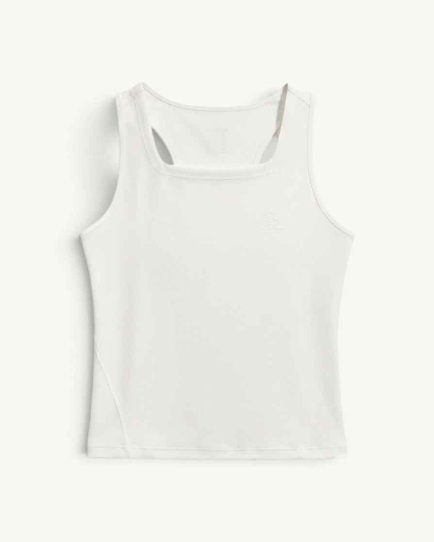 Amateur women's white Dri-FIT trail running tank top with a racerback design and reflective logo detail.