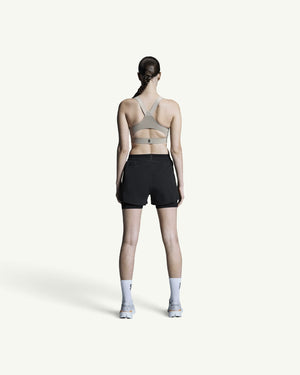 Amateur women's black 3-inch 2-in-1 performance running shorts with supportive inner tight, back view