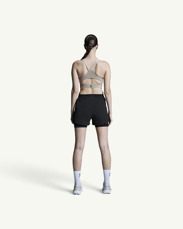 Amateur women's black 3-inch 2-in-1 performance running shorts with supportive inner tight, back view