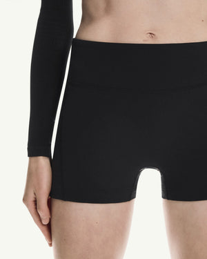 Amateur women's black 3-inch performance tights with a high-waisted, supportive stretch fit for running and training.