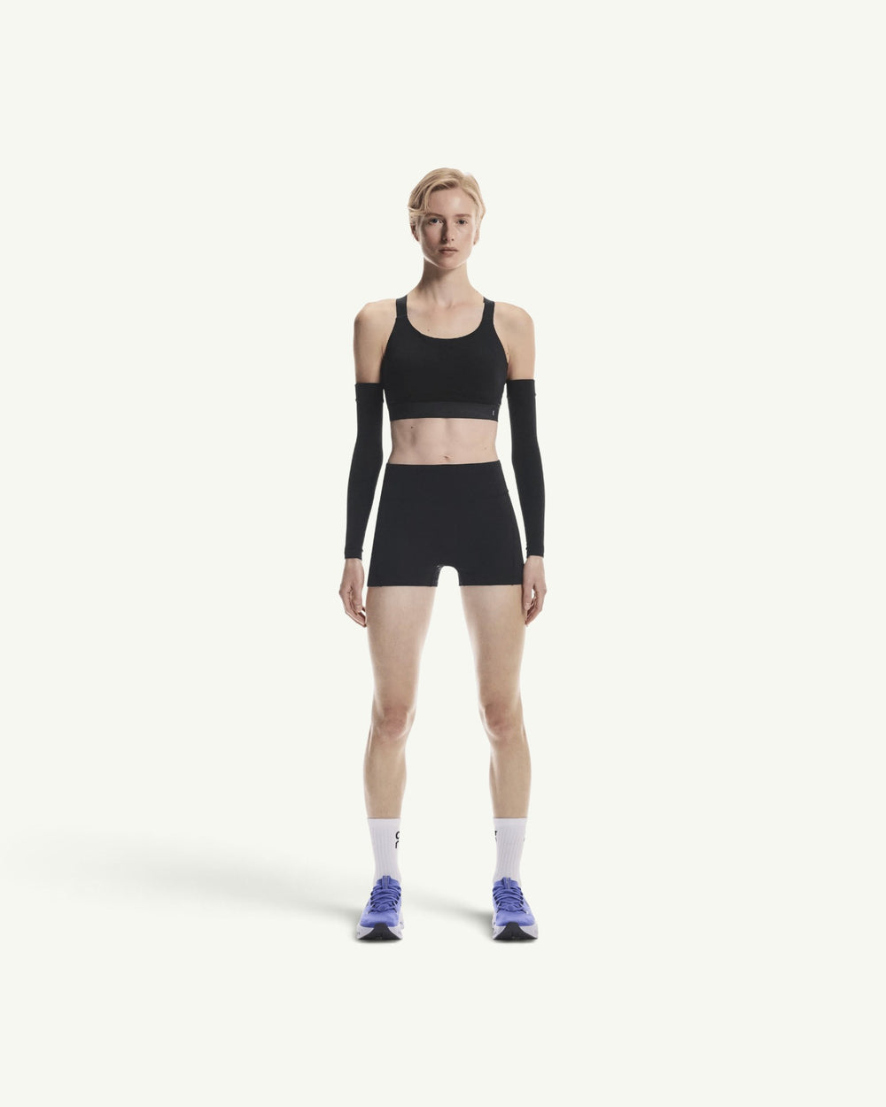 Amateur women's black 3-inch performance running shorts in supportive stretch fabric for track and interval training.