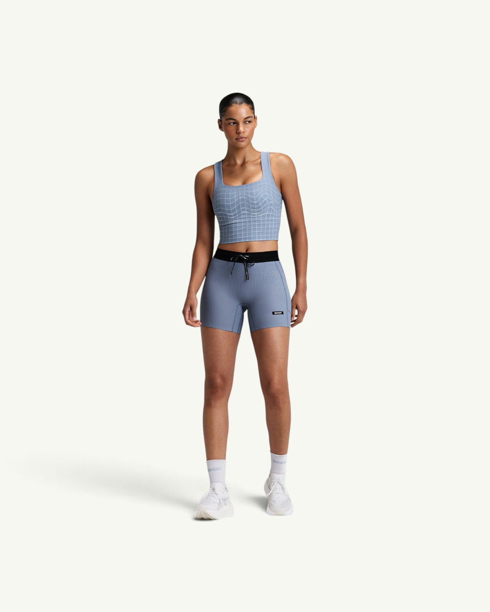 Amateur women's Vanisher square neck race crop in light blue with white grid pattern and back GeoMesh panel.