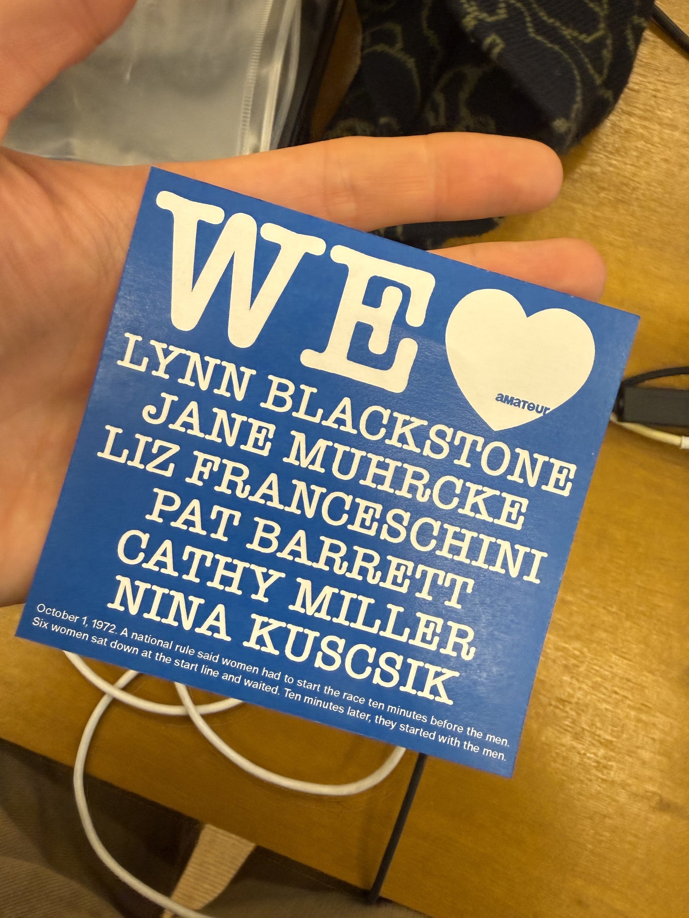 A sticker that says We love, with a blue heart